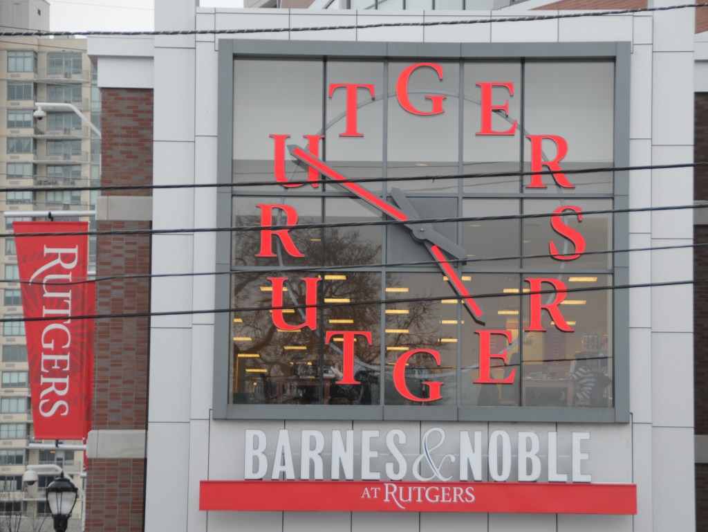 Barnes & Noble at Rutgers signage with a Rutgers clock.