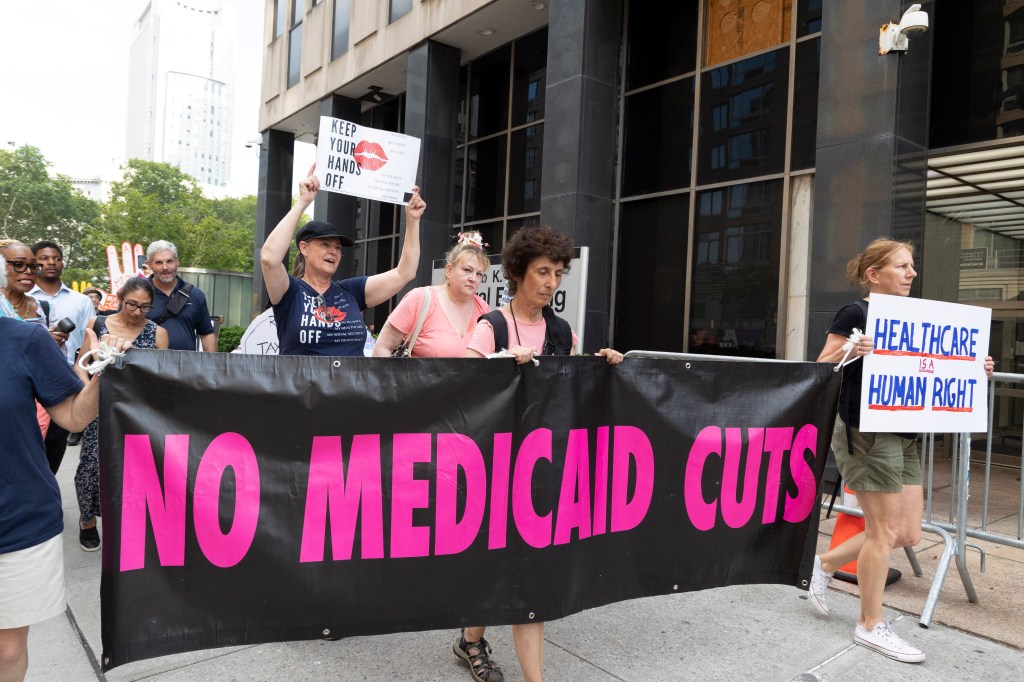 Protestors marching for Medicare and Medicaid.