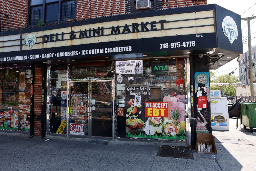 Makeshift memorial outside a deli.