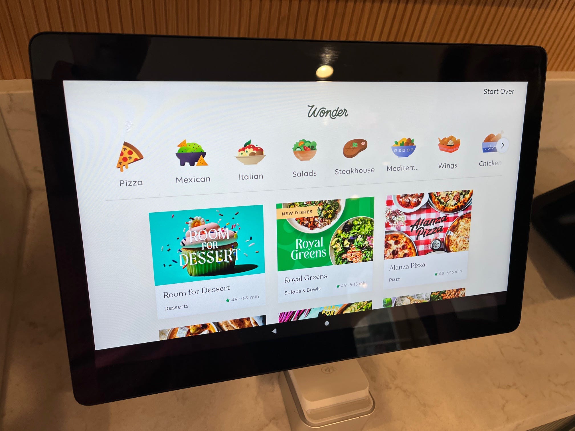 The ordering touchscreen at a Wonder location, which includes menus for specific restaurant concepts as well as dishes organized by category