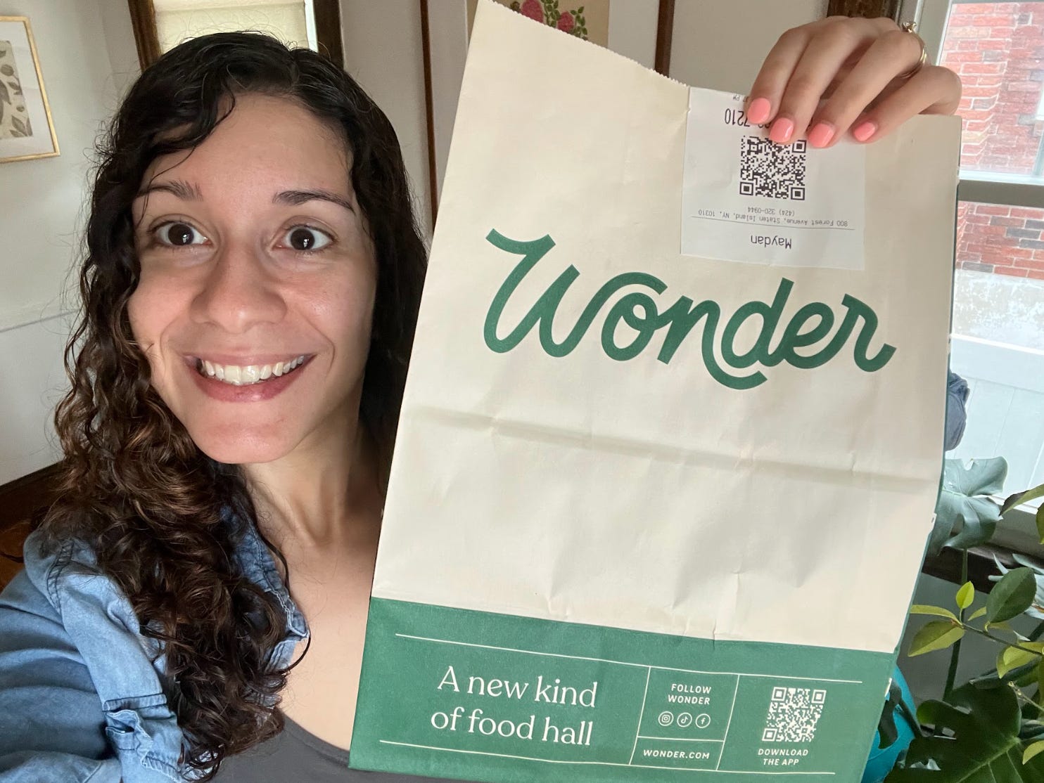 The author posing with her bag of food from Wonder