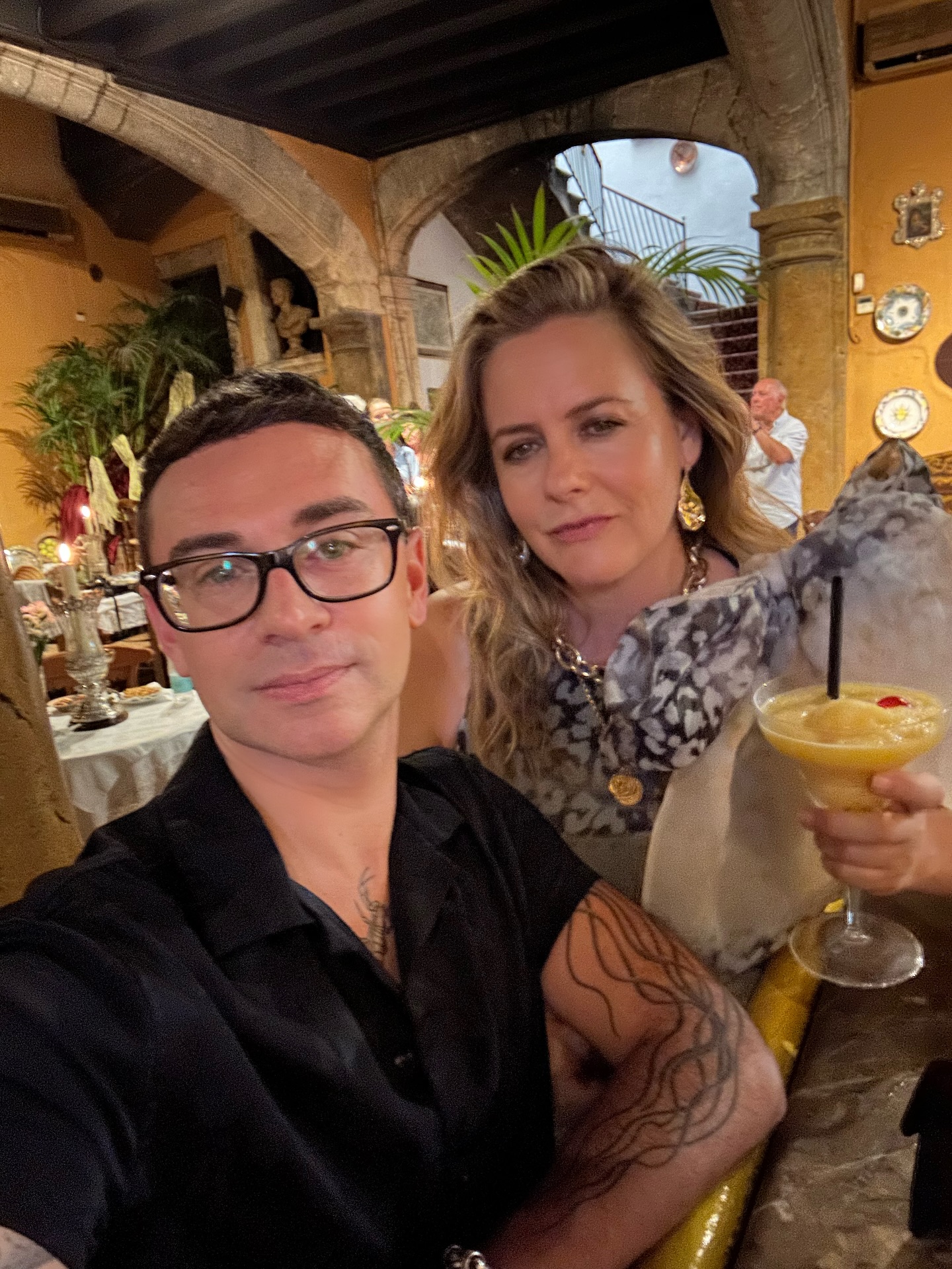 Christian Siriano and Alicia Silverstone catch up in Mallorca during a wedding.