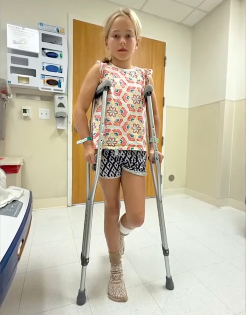 Girl on crutches after a sea lion bite.
