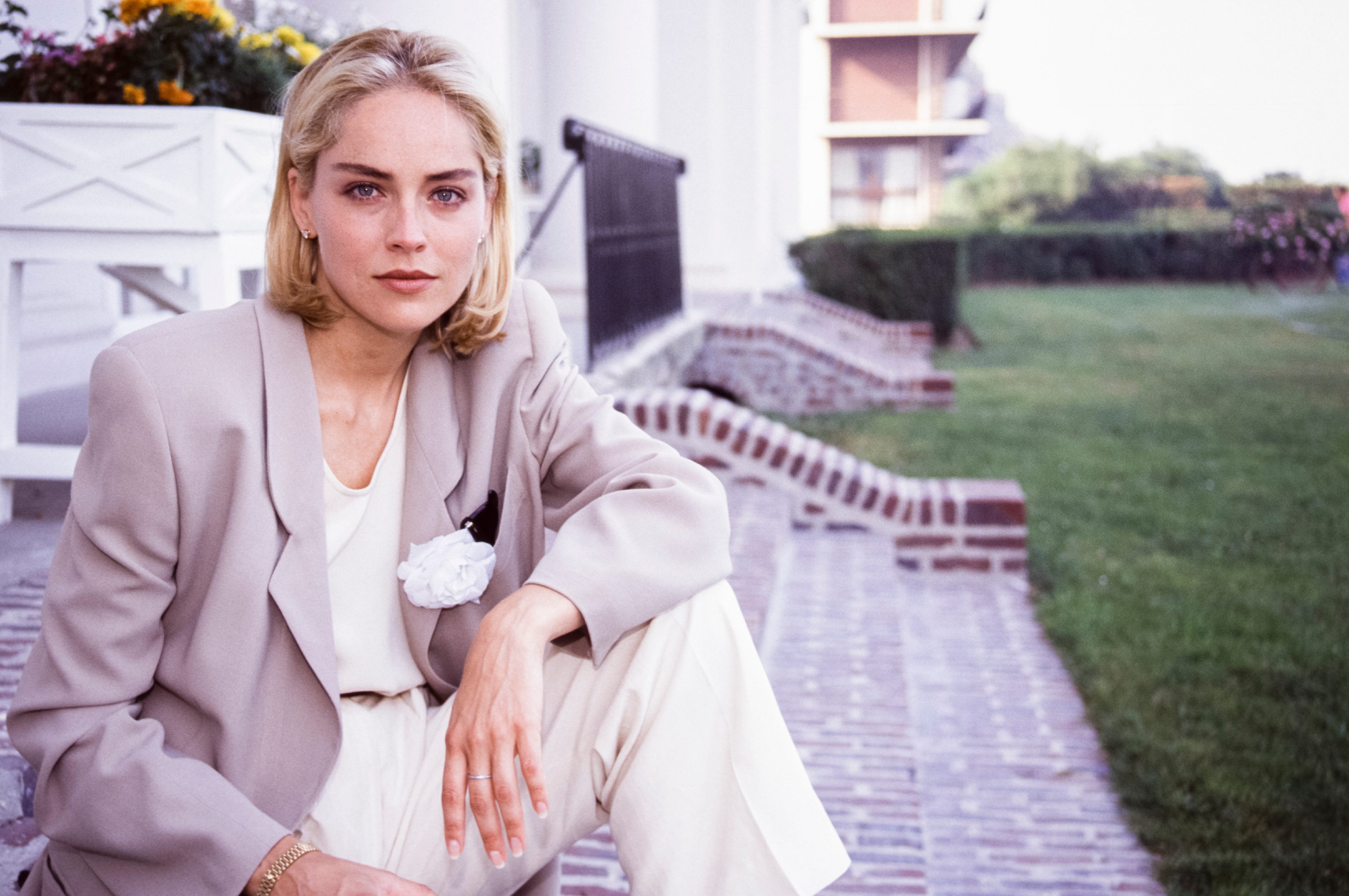 Sharon Stone sitting on stairs