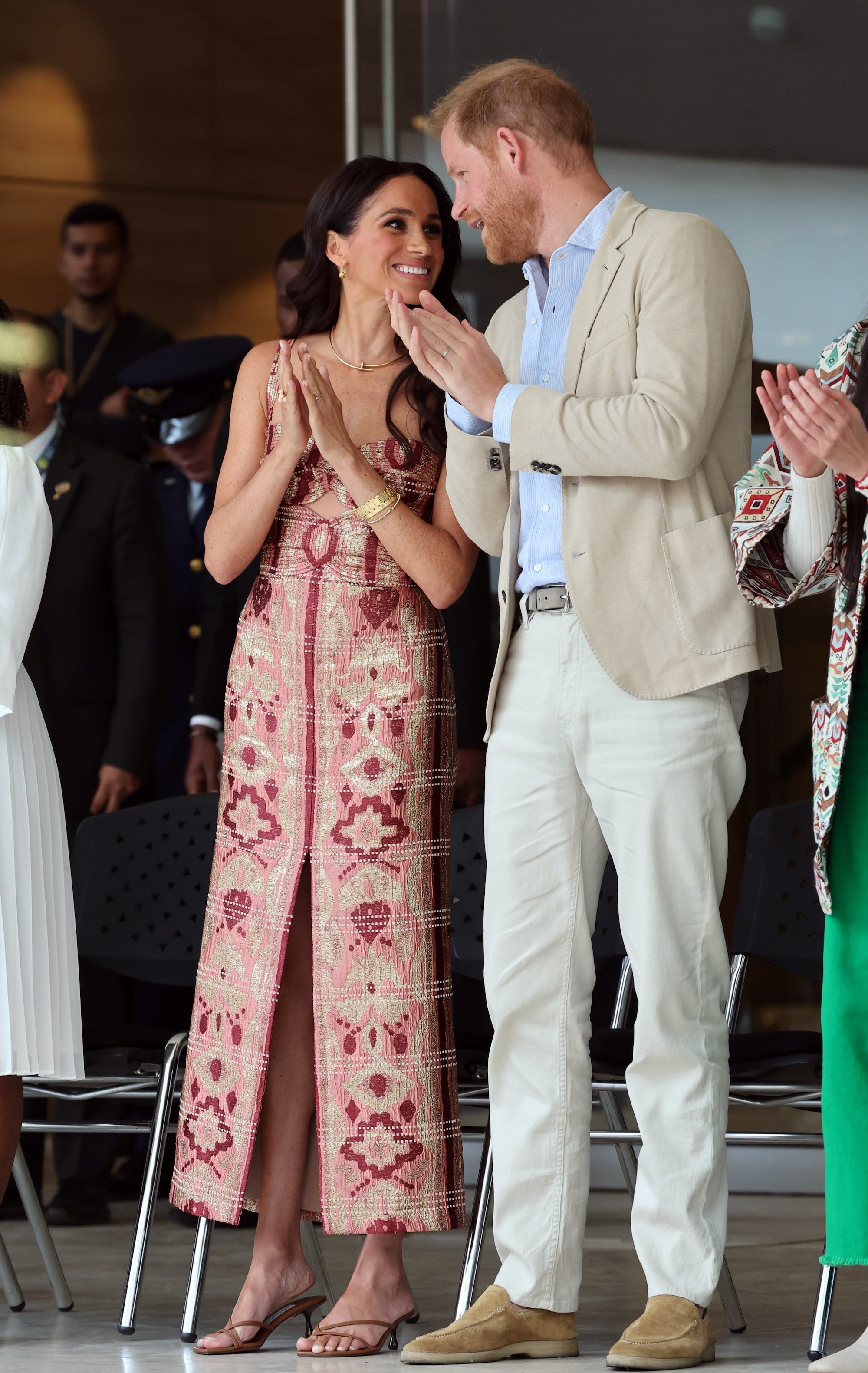 Prince Harry and Meghan Markle smile at each other in Colombia in August 2024.