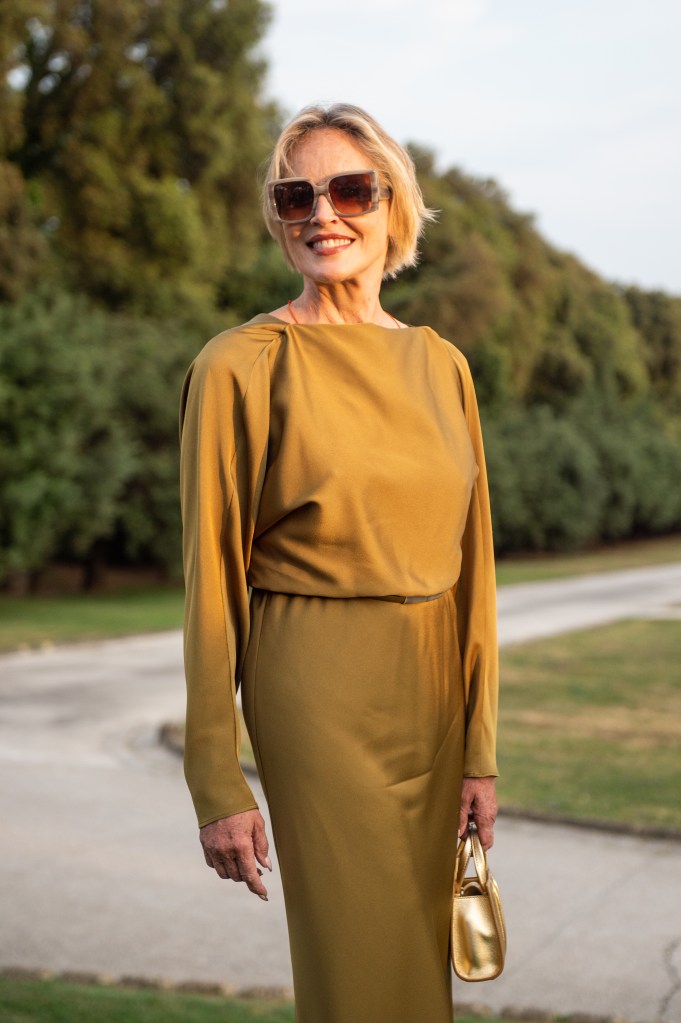Sharon Stone smiling while wearing sunglasses.