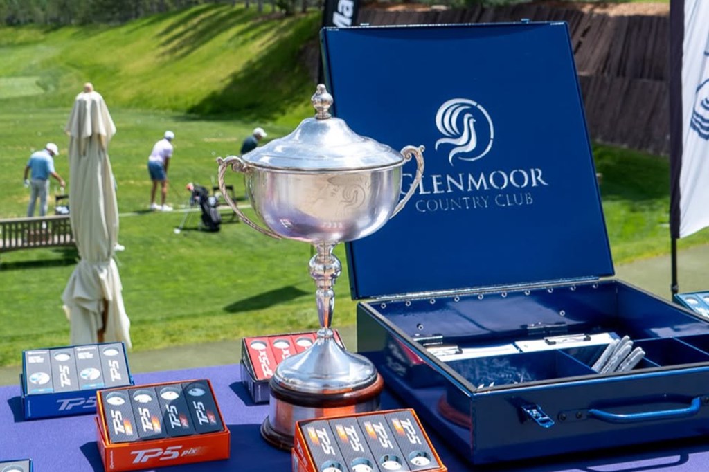 Glenmoor Country Club trophy on a table with golf balls.