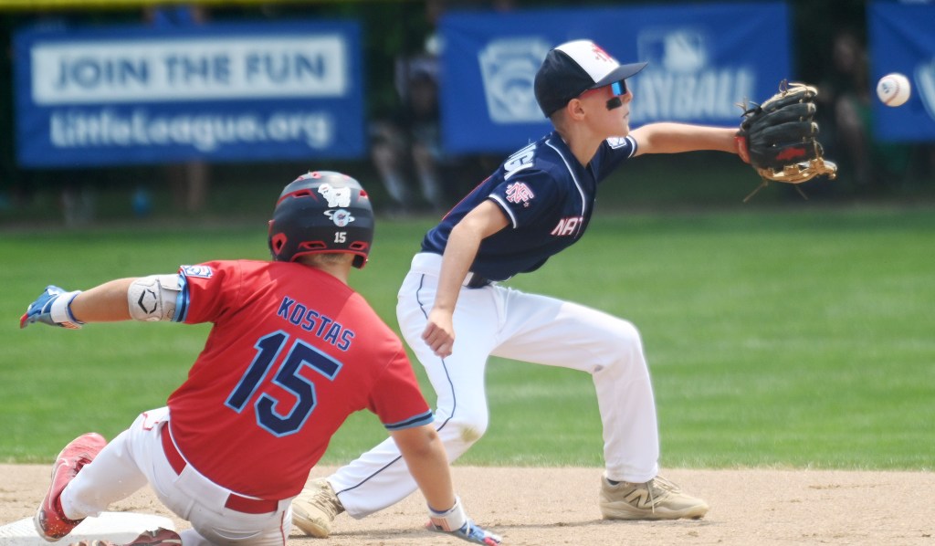 St James Smithtown Lucas Kostas (15) slides in safely a head of the tag by Fairfield second baseman Charlie McCullough (11) for a run scoring double in the second inning during the East Regional Little Tournament game.