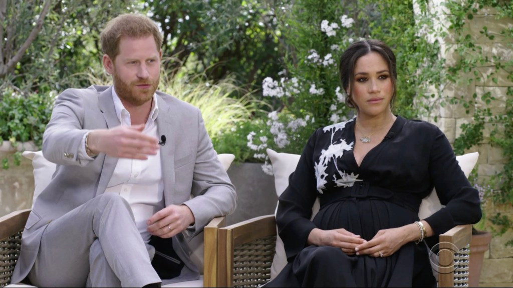 Meghan Markle and Prince Harry being interviewed by Oprah Winfrey on CBS