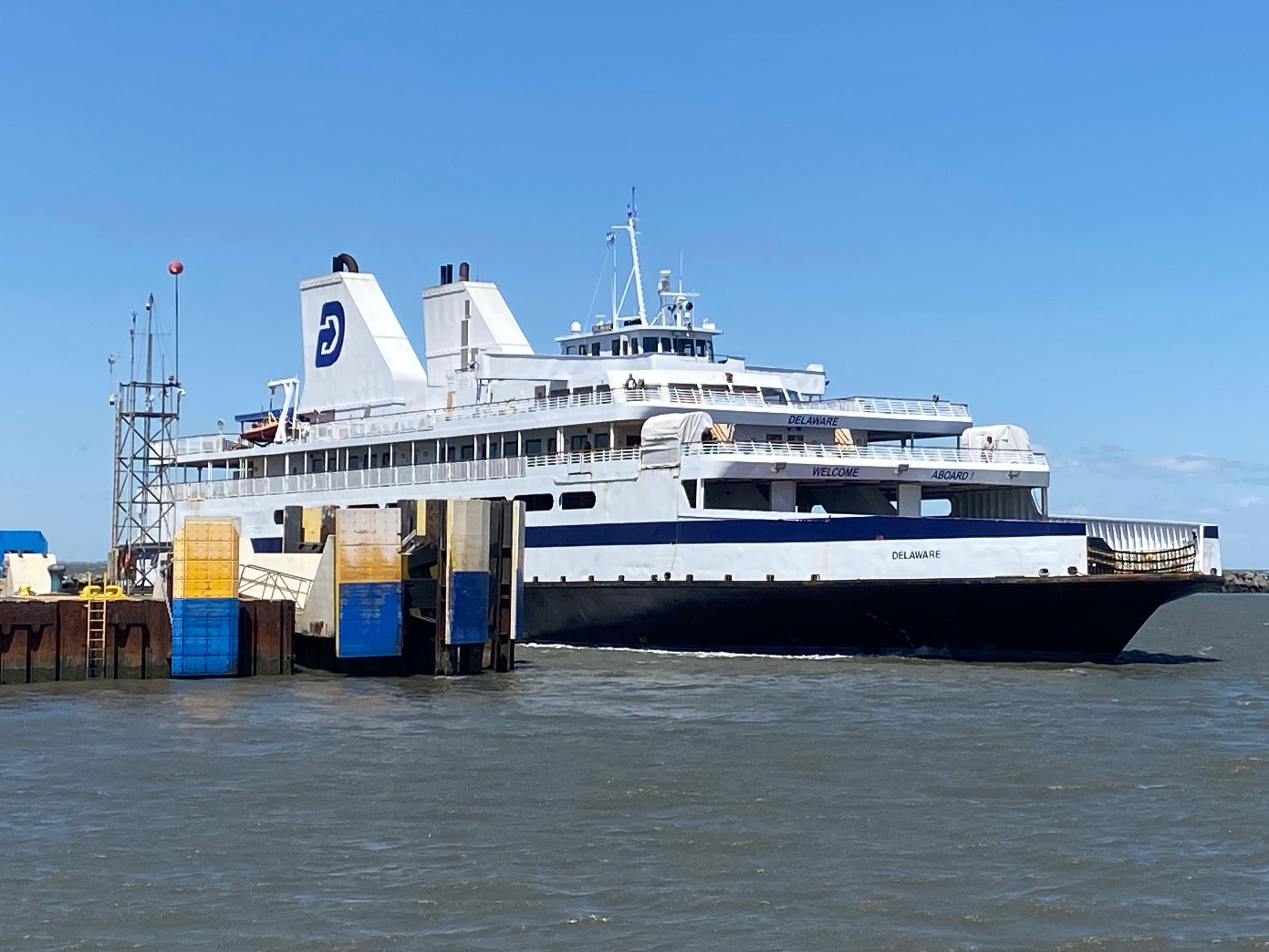 A large ferry pulling into the port.