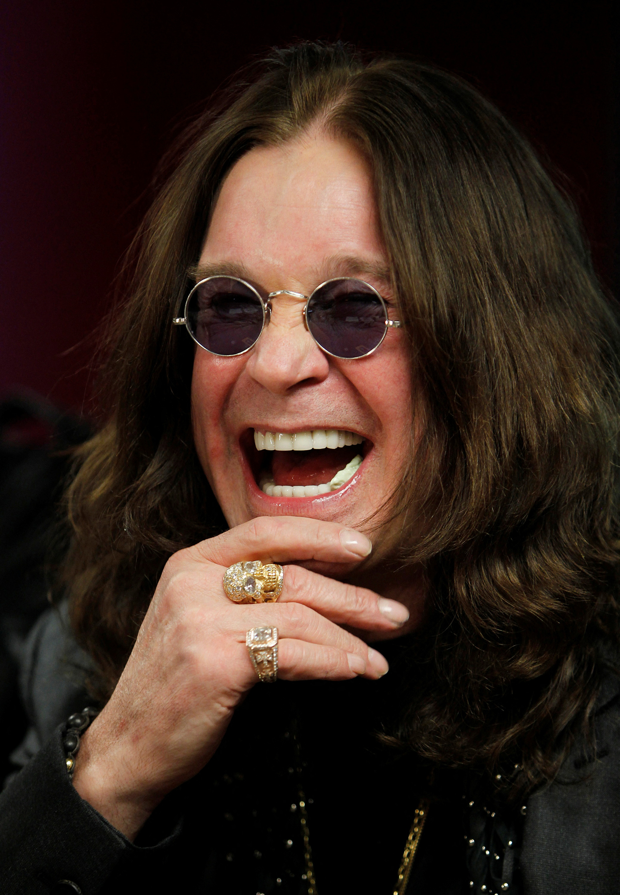 Ozzy Osbourne laughs. 