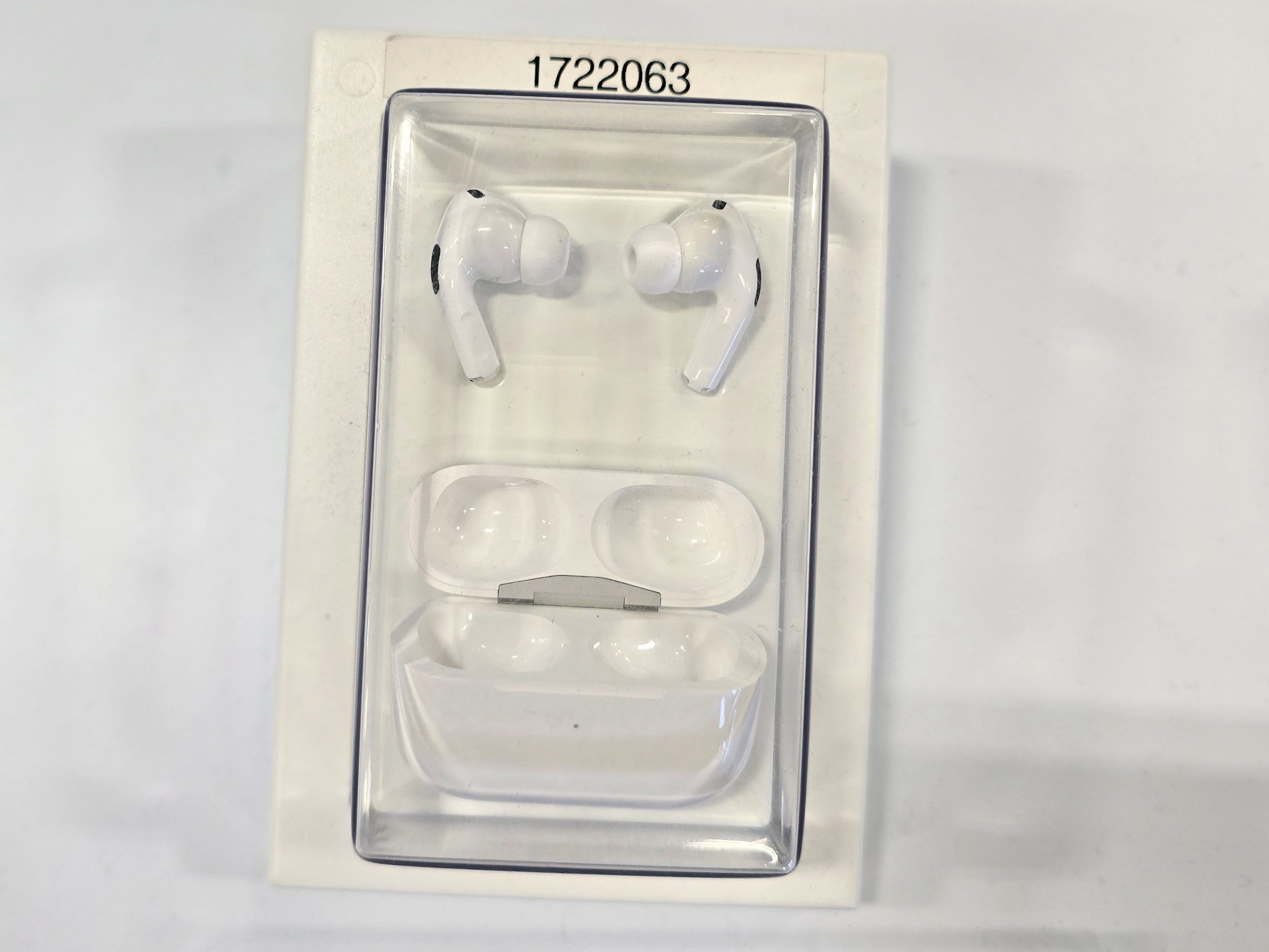 A pair of Apple iPod Pro 2 earbuds with a charging case.