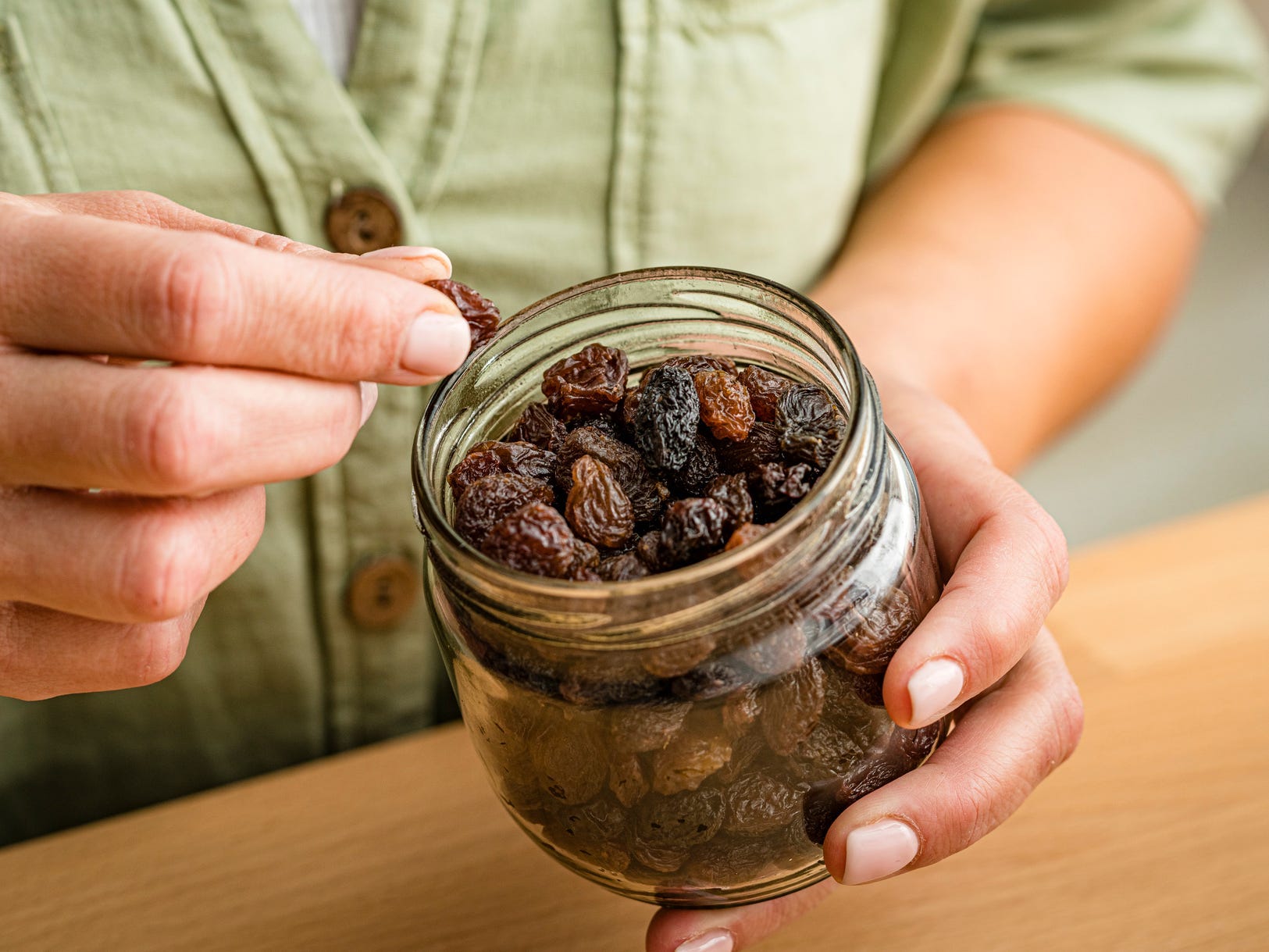 Person eating raisins
