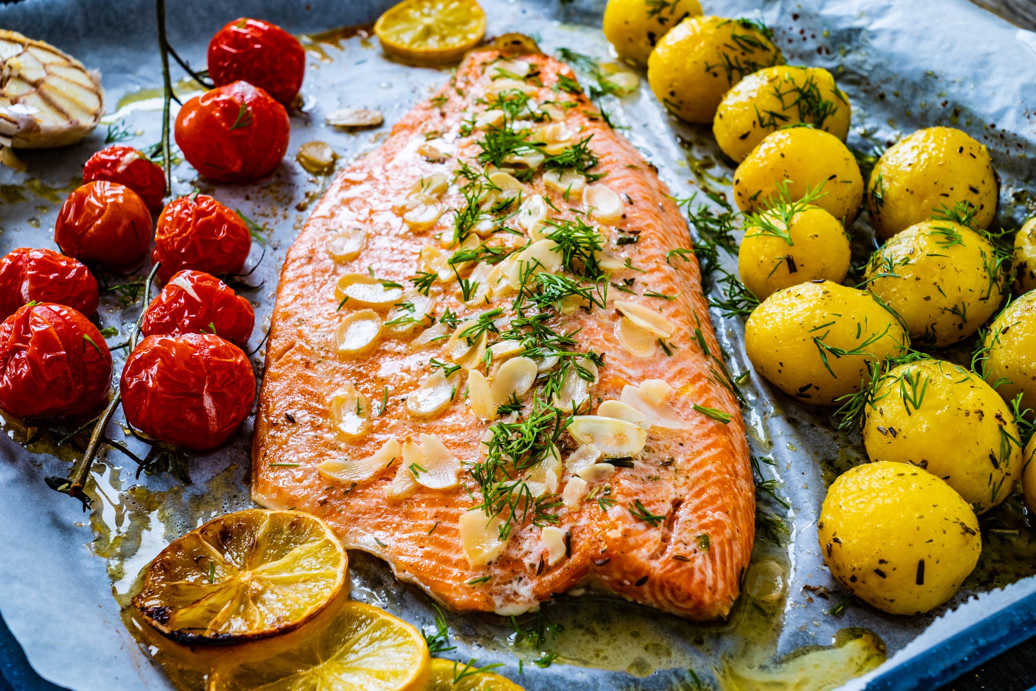 A sheet pan with salmon and vegetables