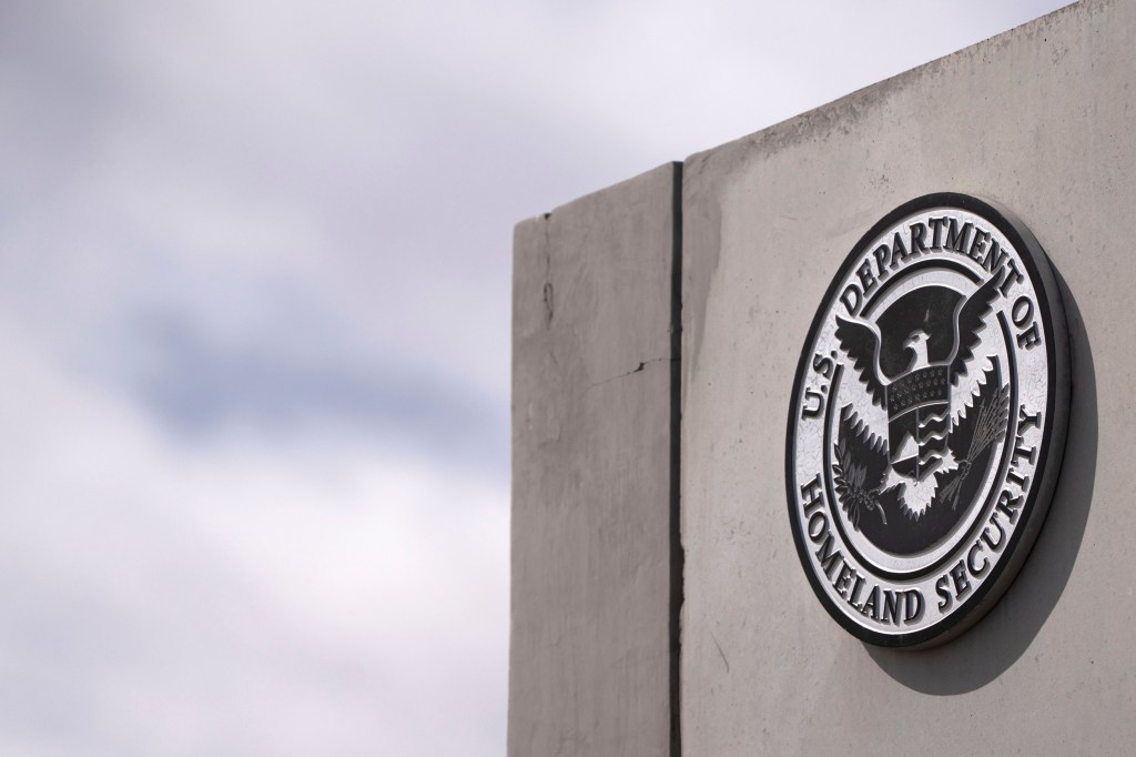 Department of Homeland Security seal on a wall.