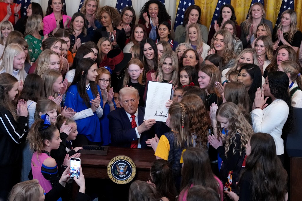 President Trump signing the 