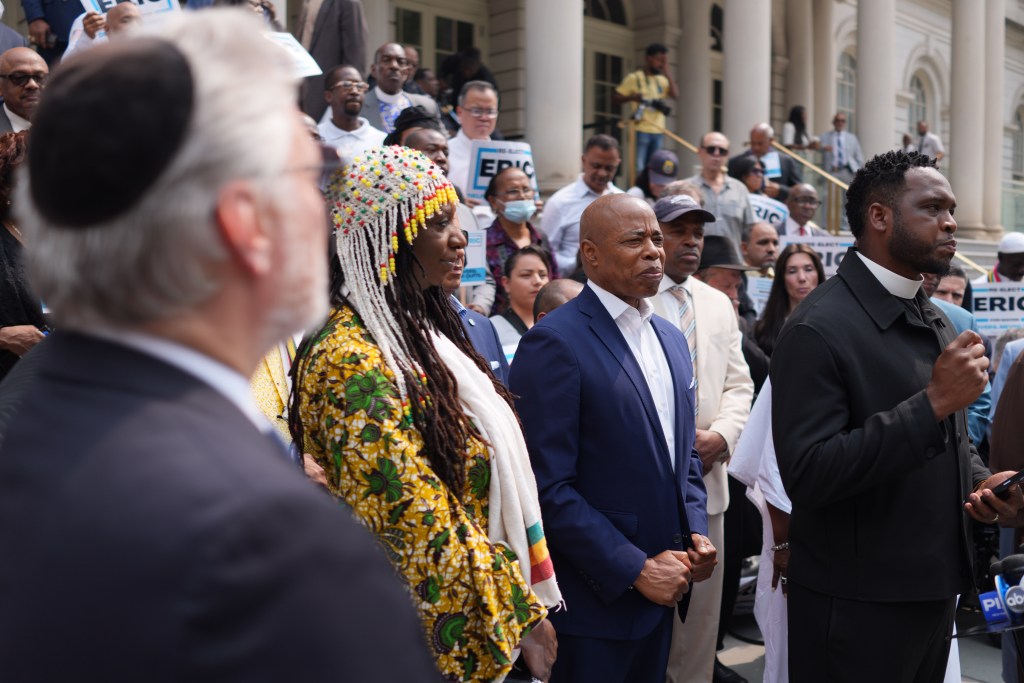 Mayor Eric Adams with faith leaders at a re-election endorsement ceremony.