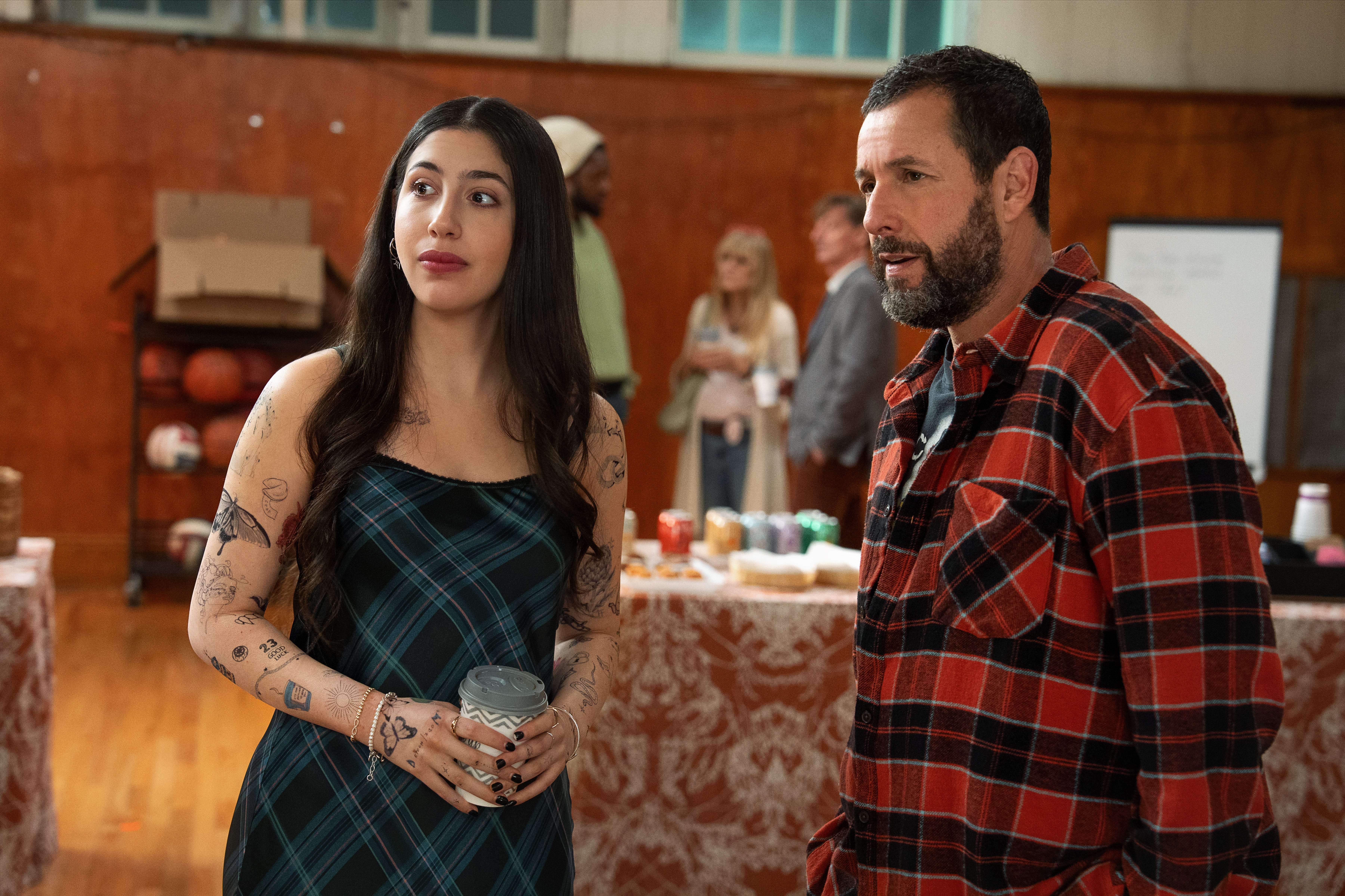 Sadie Sandler standing next to Adam Sandler
