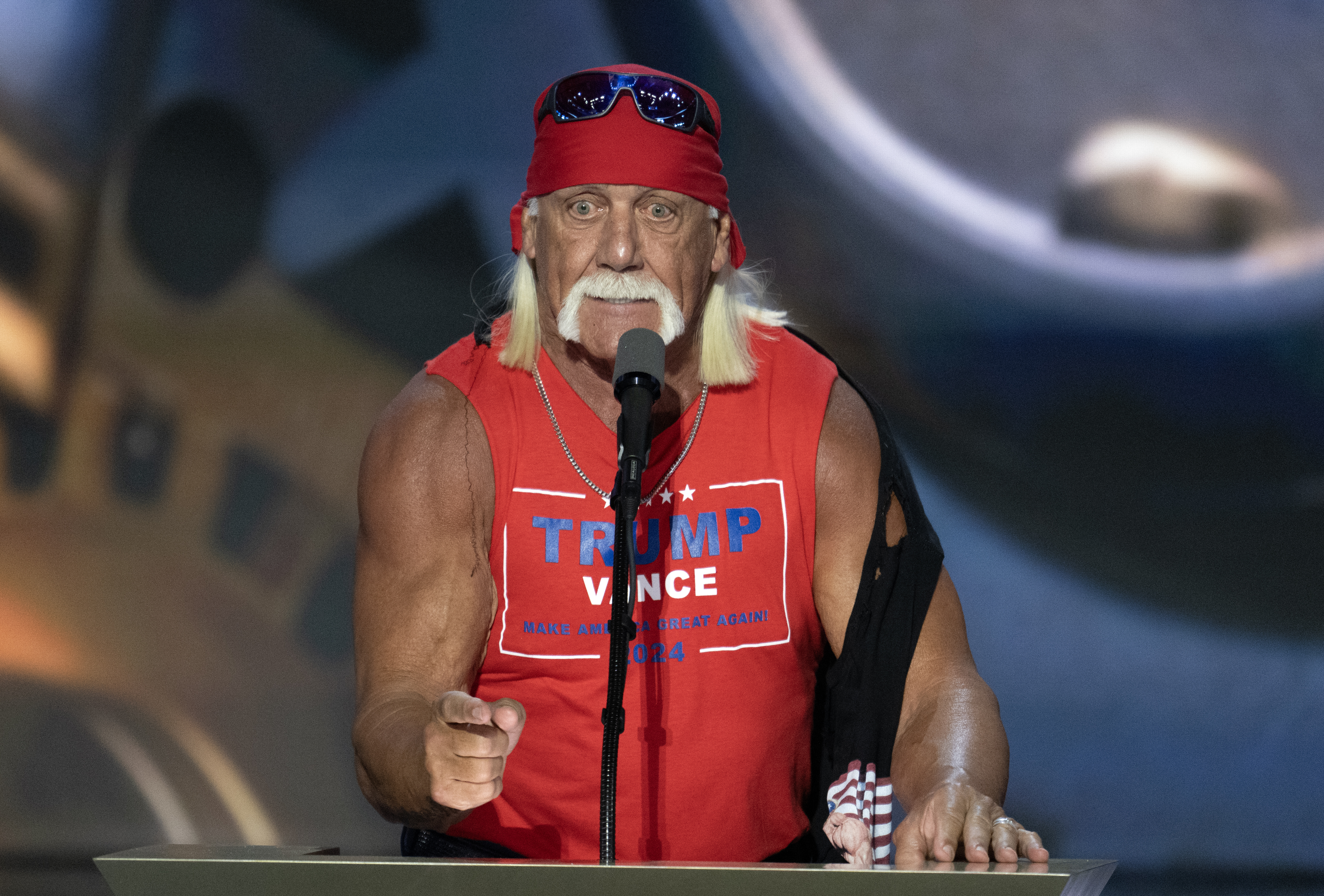Hulk Hogan speaks at a microphone. 