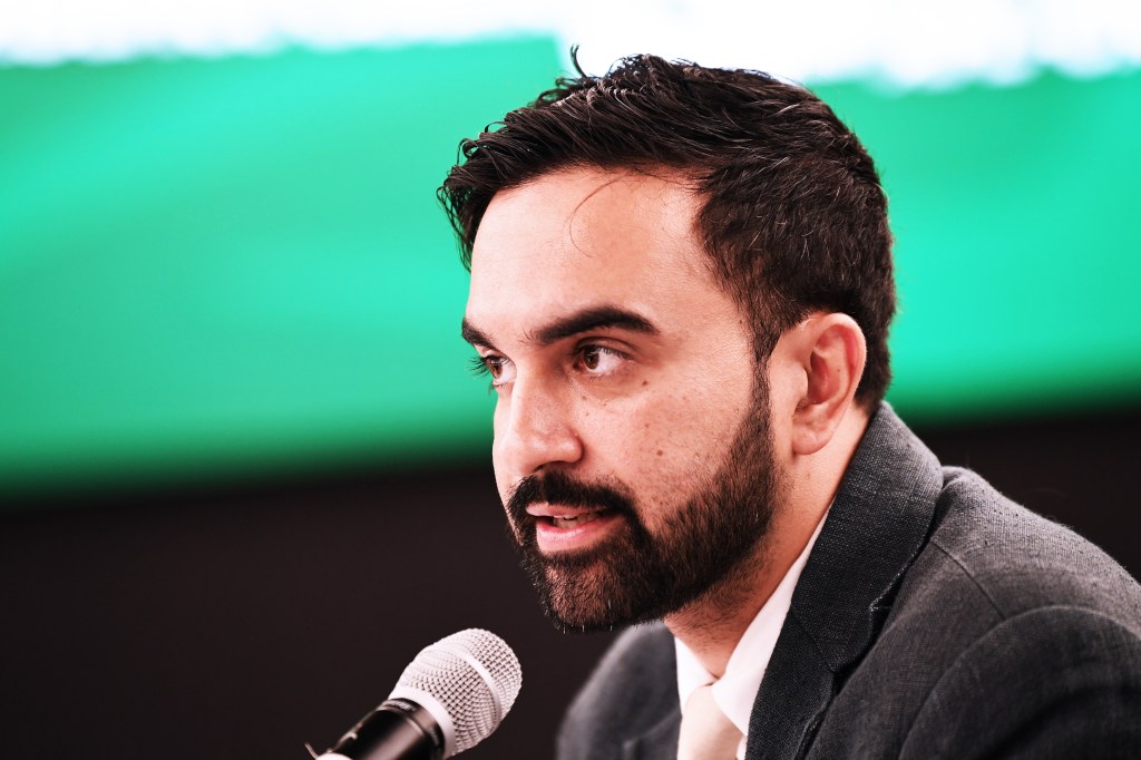 Photo of Zohran Mamdani speaking at a press conference.