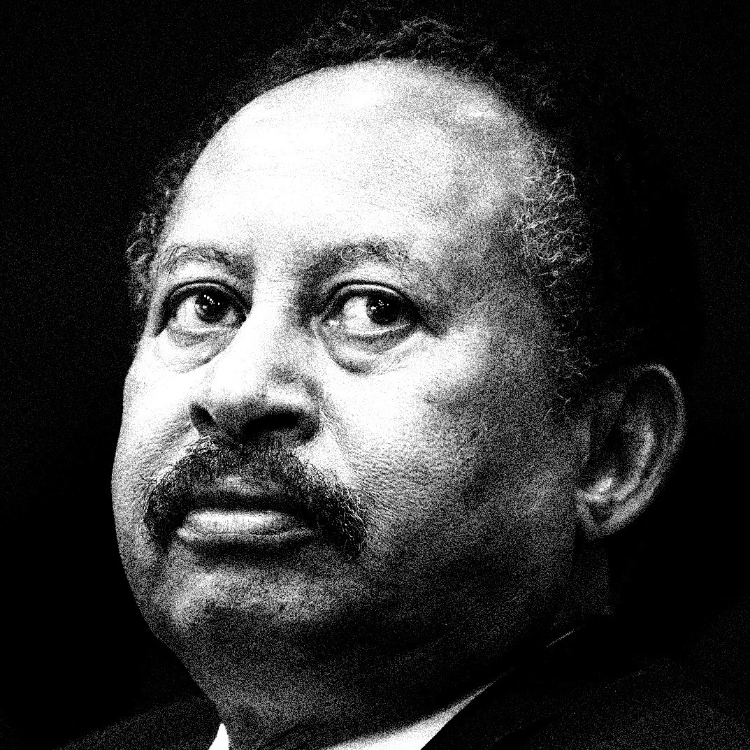 black-and-white photo of balding man with mustache looking up and to right