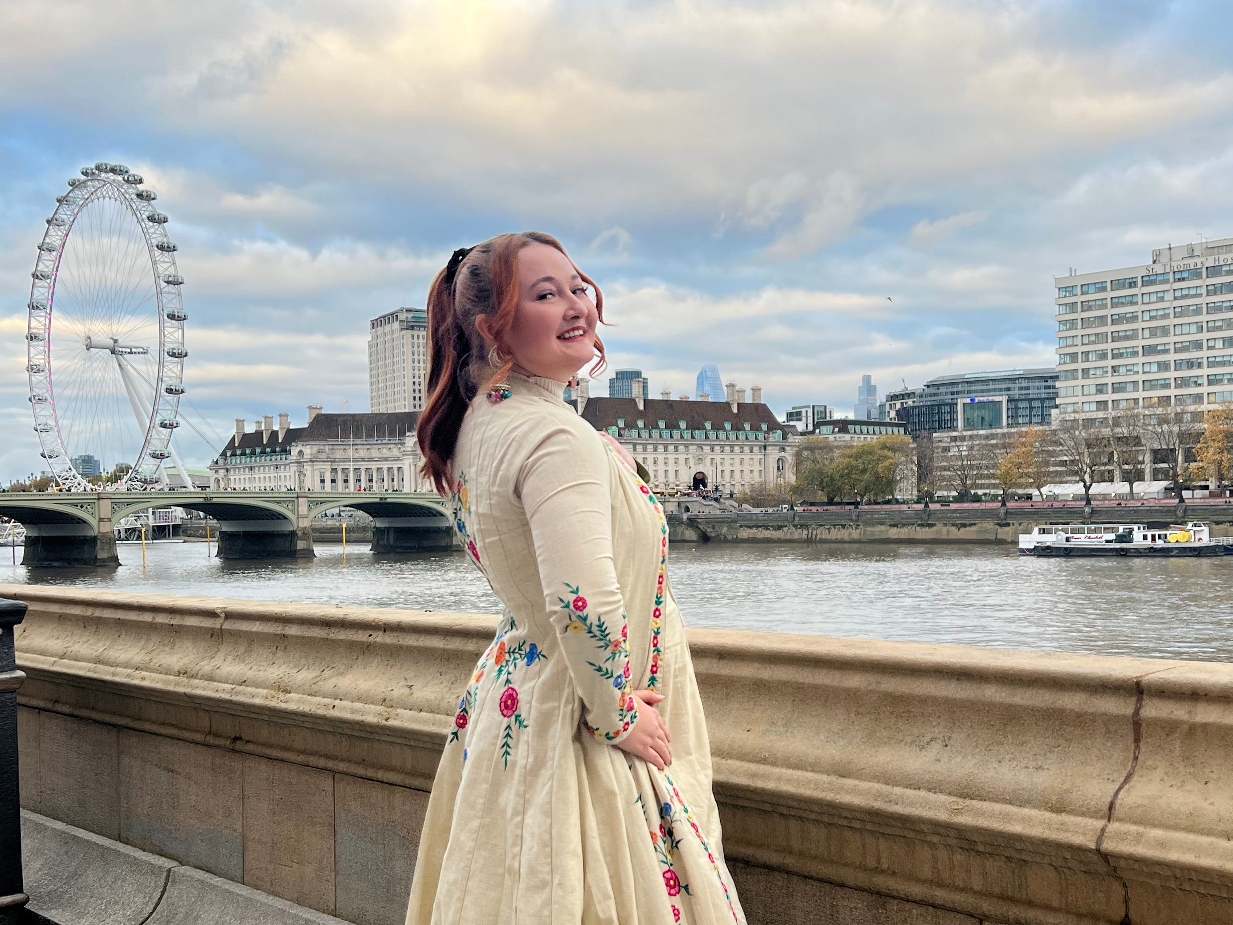 The author posing in London with the London Eye in the background.