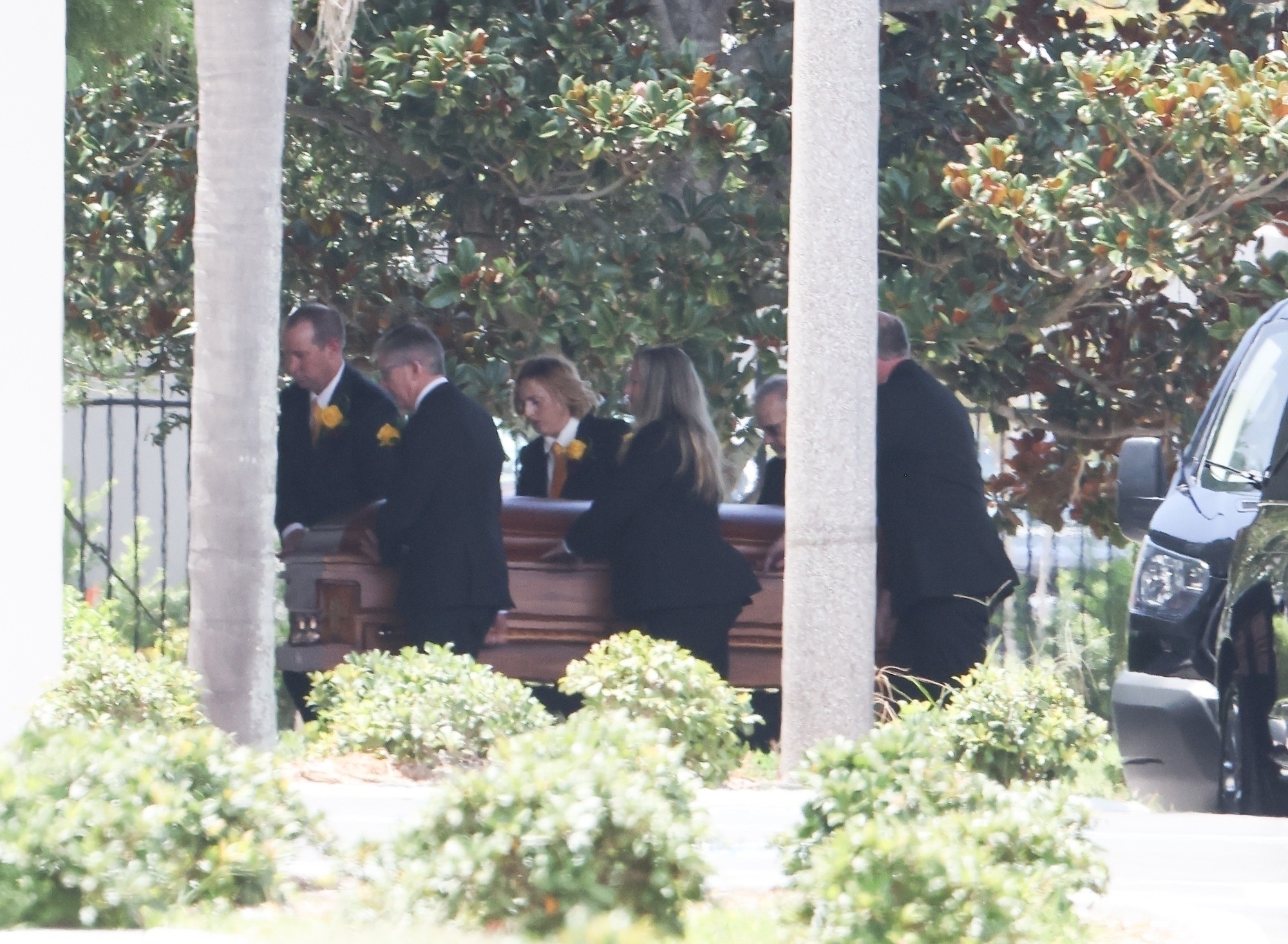 People carrying Hulk Hogan's casket