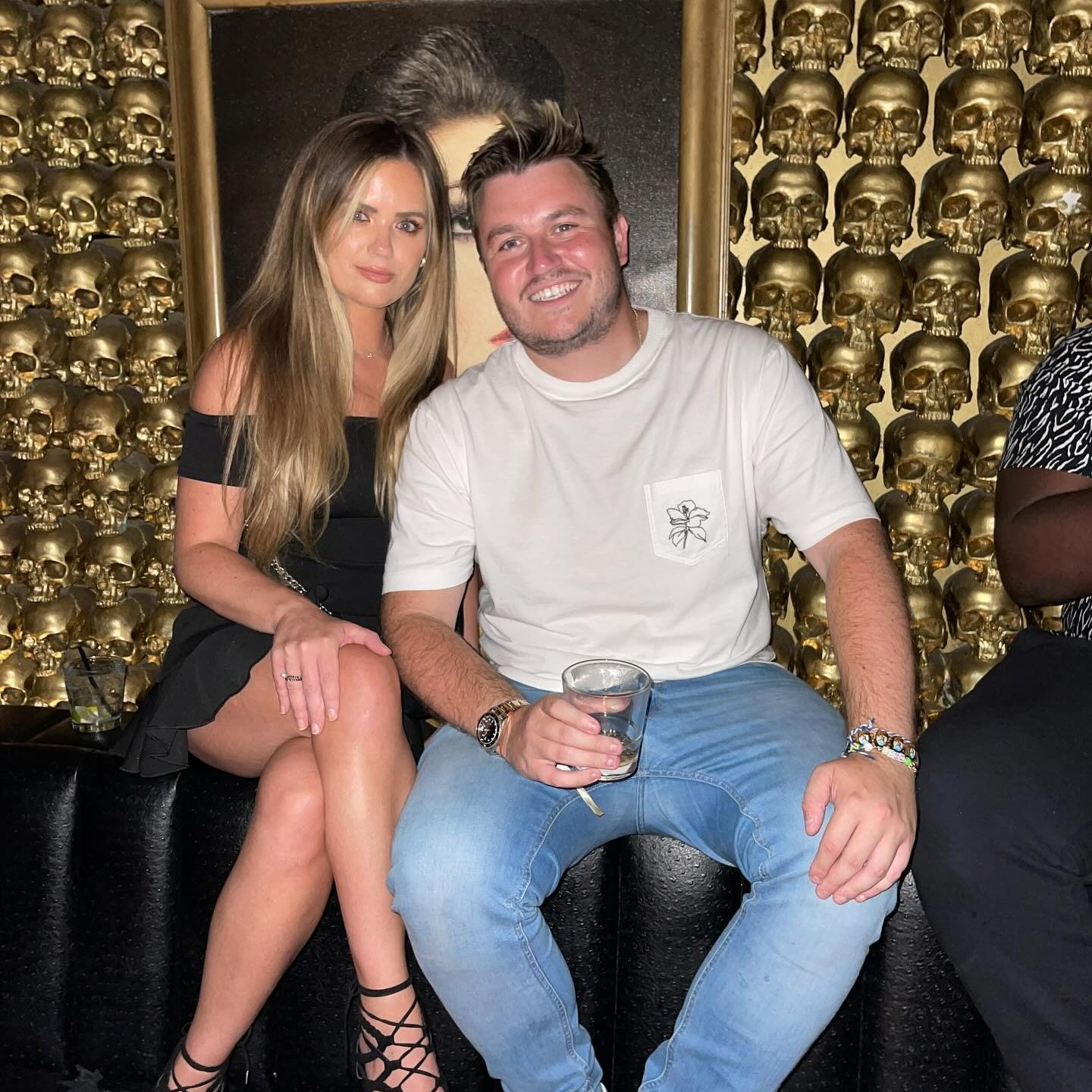 Photo of a man and woman sitting together in a bar.