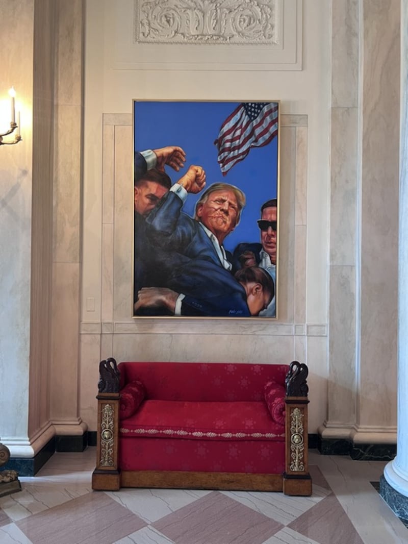 A picture of Trump after the assassination attempt has replaced a portrait of Barack Obama.