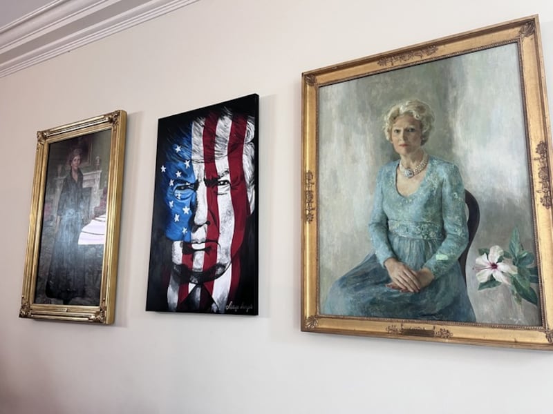 Trump has inserted a picture of himself between two former first ladies.