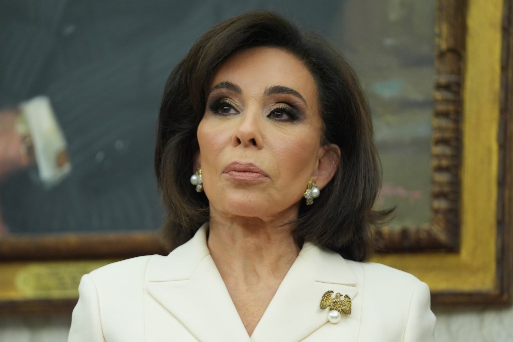 Jeanine Pirro listening to Donald Trump.