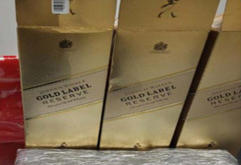Three boxes of Johnny Walker Gold Label Reserve whiskey.