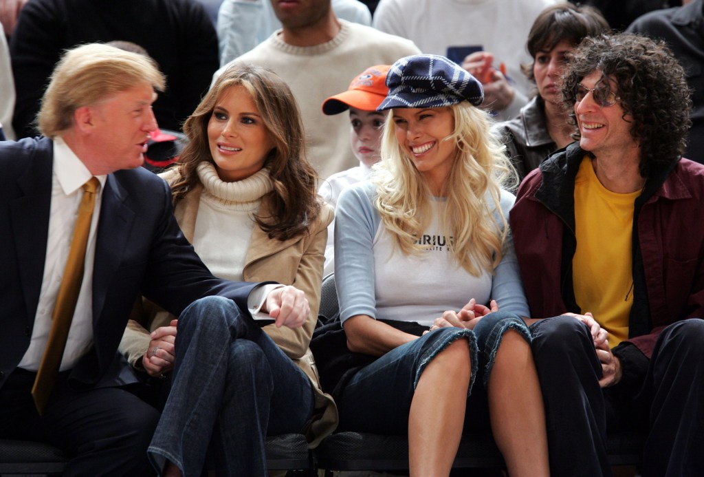 Donald Trump, Melania Trump, Beth Ostrosky and Howard Stern sit courtside at the Washington Wizards - New York Knicks game on Nov. 4, 2005.