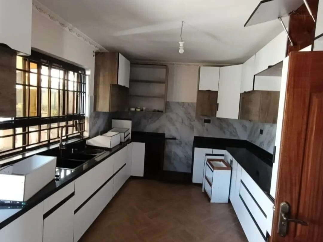 kitchen with white old outdated cabinets