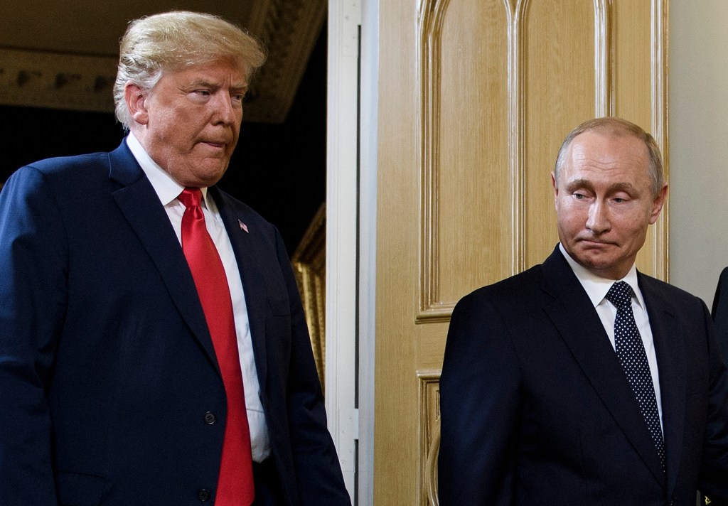 Trump and Putin at a meeting.