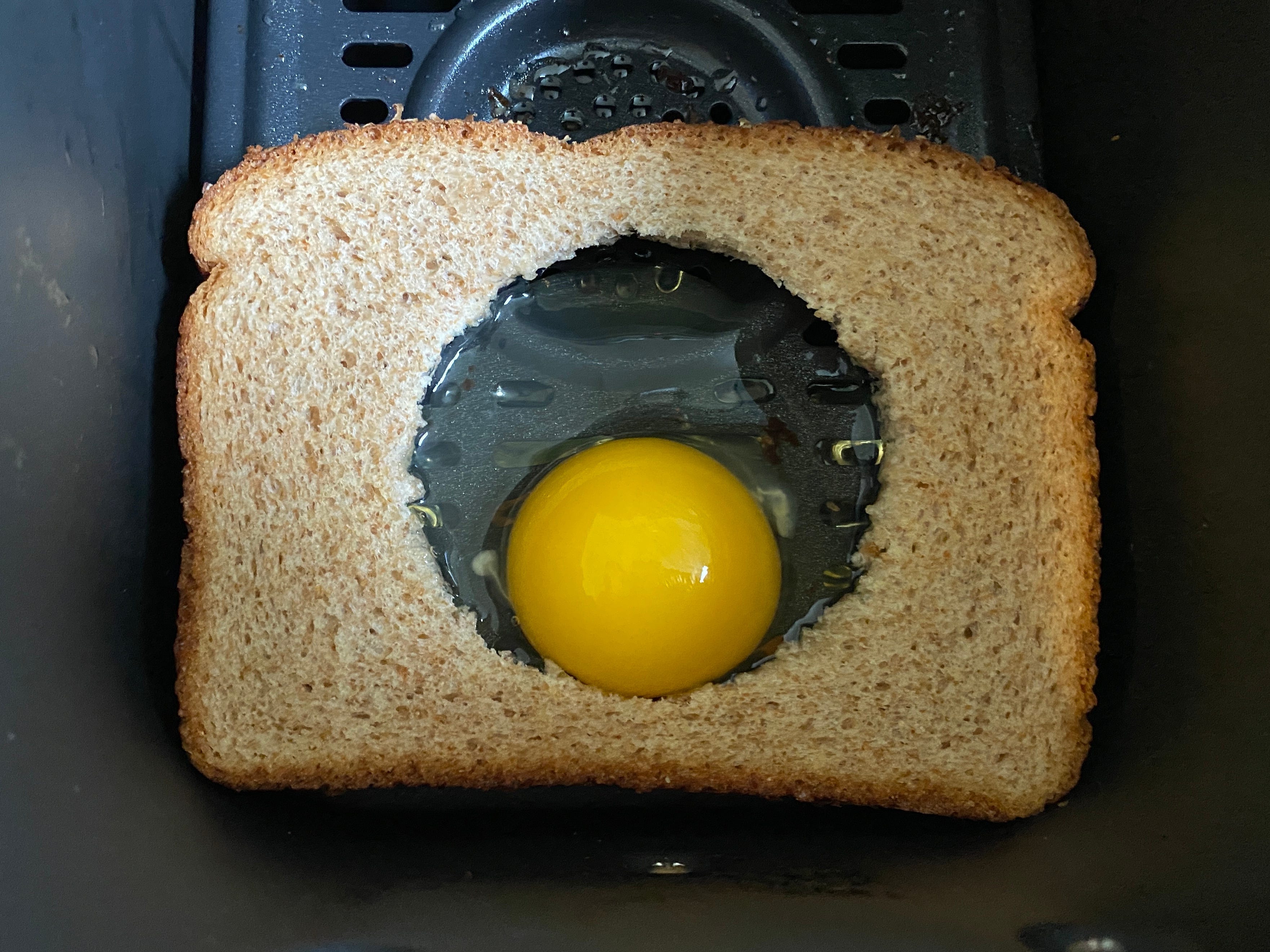 egg in a hole in air fryer basket