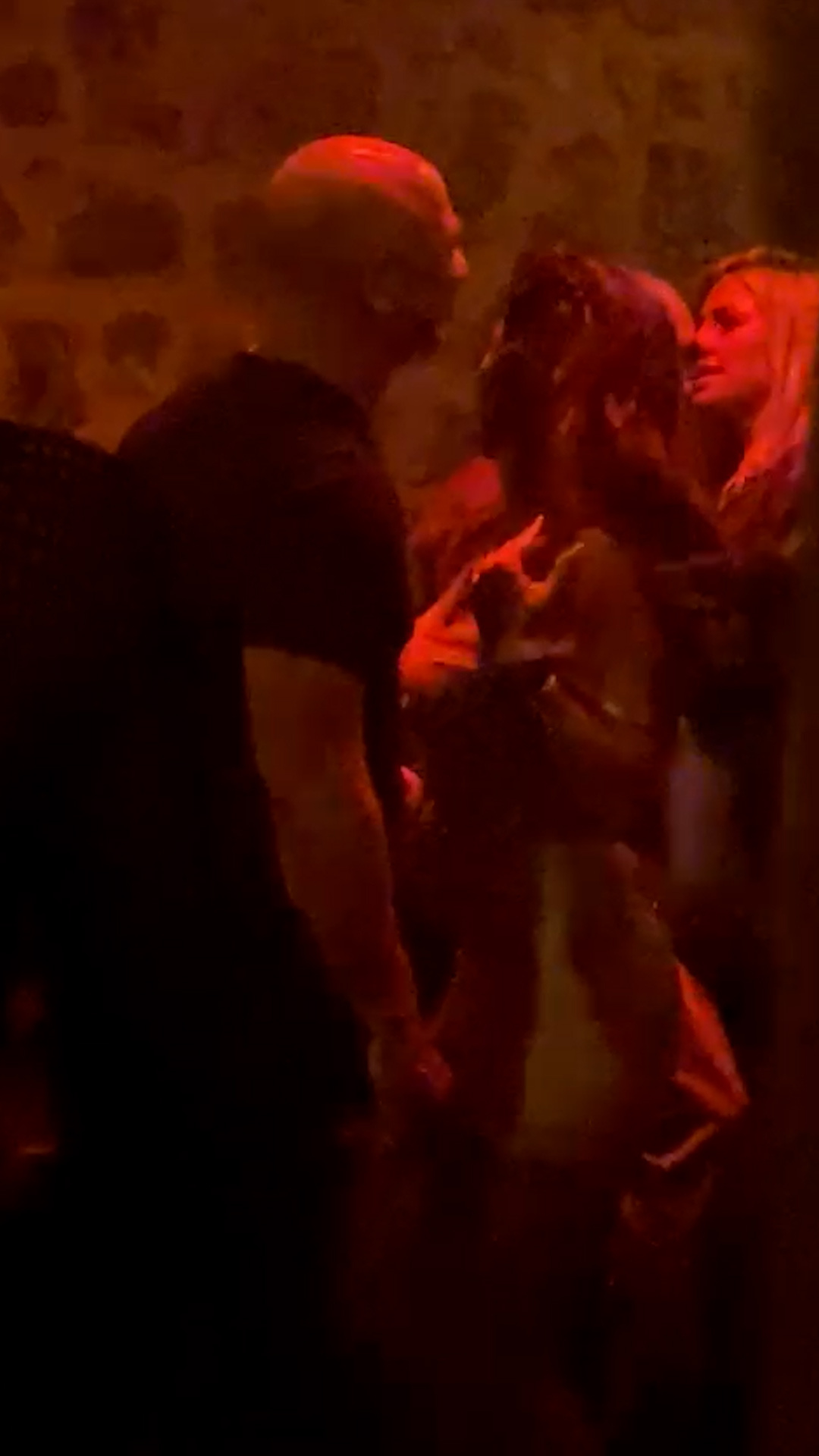 Lauren Sánchez and Jeff Bezos dancing inside an Ibiza nightclub.