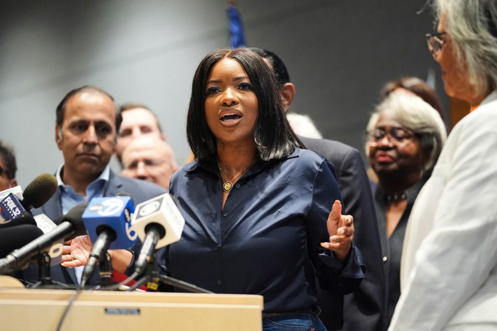 A woman speaks at a press conference.