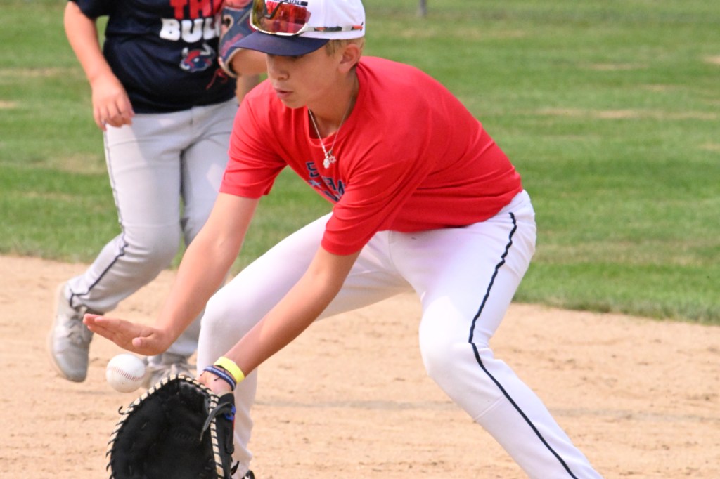 Jeremy Katz of St. James-Smithtown Little League fields a grounder during practice on Aug. 6, 2025.