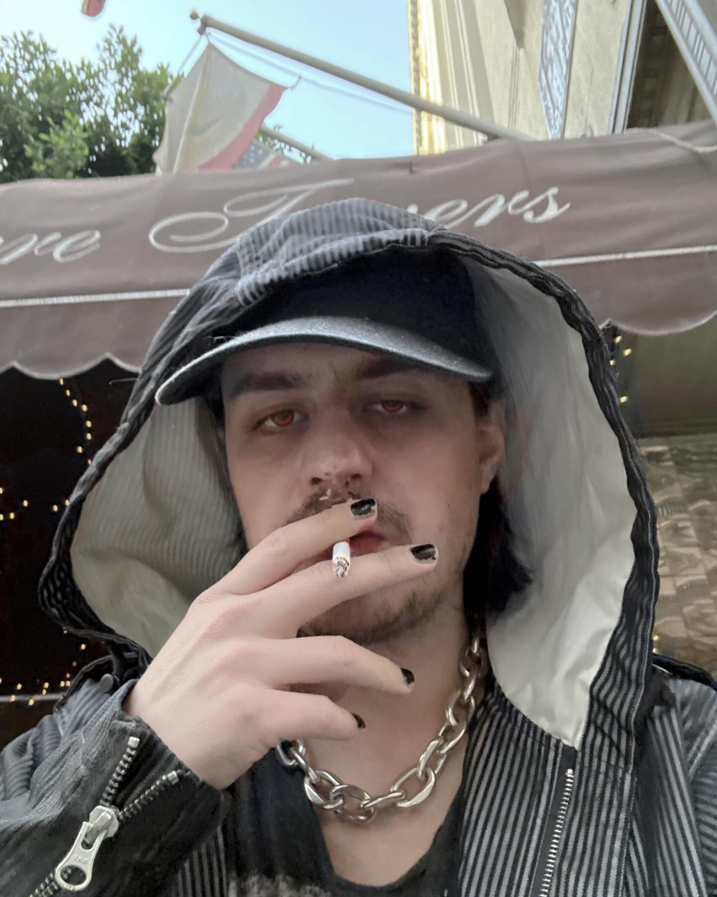 Sean Knight Nicholson smokes a cigarette. 