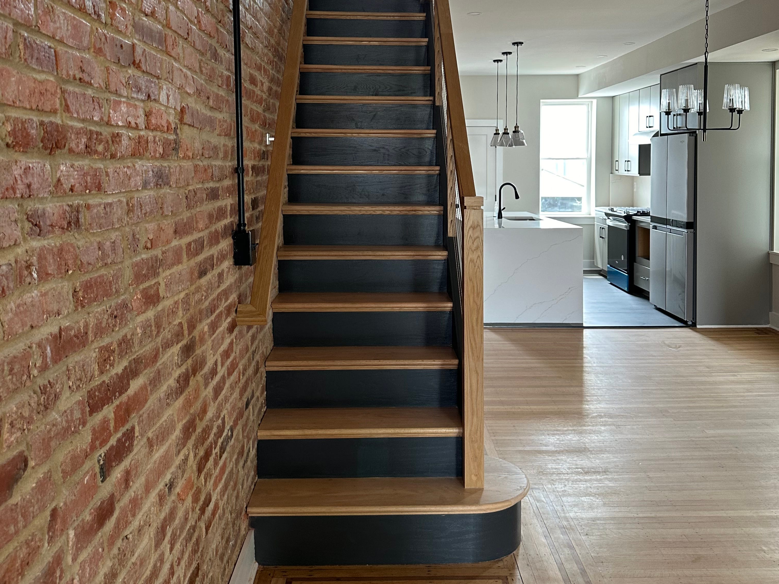 exposed brick wall inside of a newly renovated home