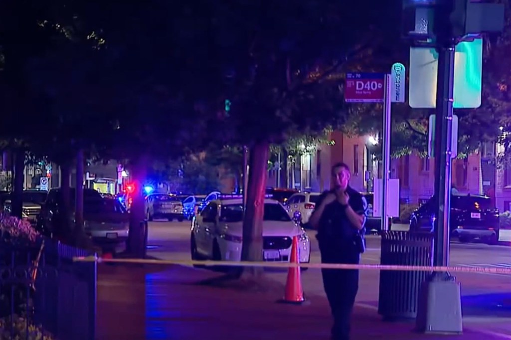 Crime scene at night with police cars and officers.