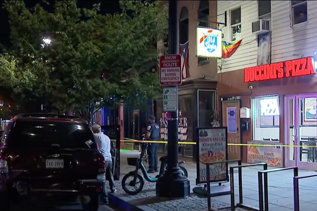 Crime scene tape at a triple shooting location.
