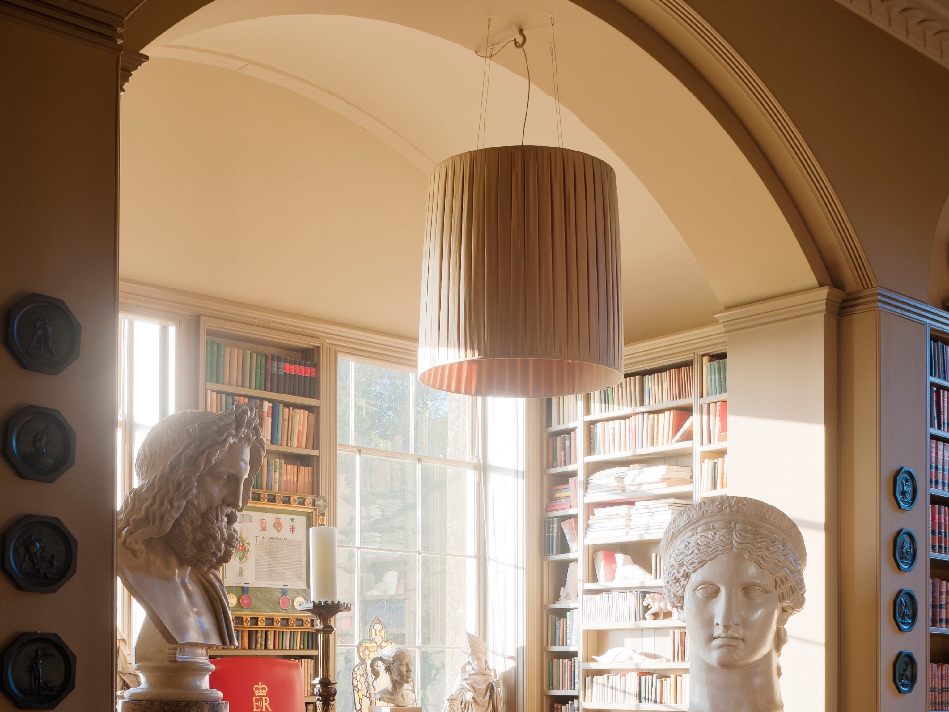 A room with a large boho-style light fixture
