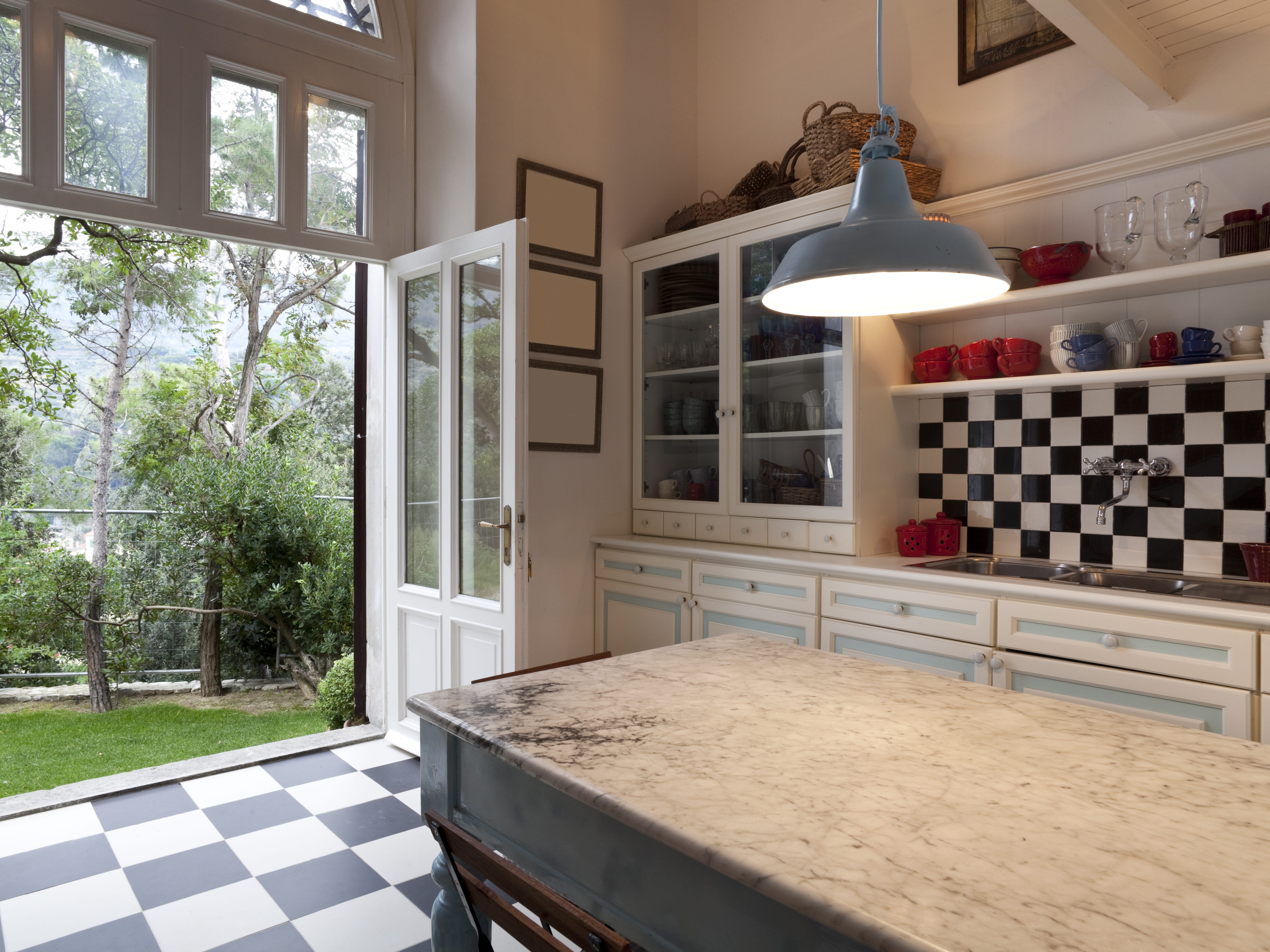 Black-and-white checkered kitchen backsplash and flooring