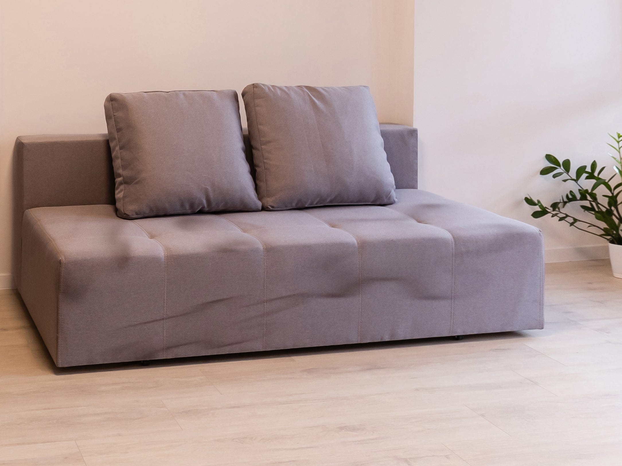 Dirty, cheaply made mauve couch