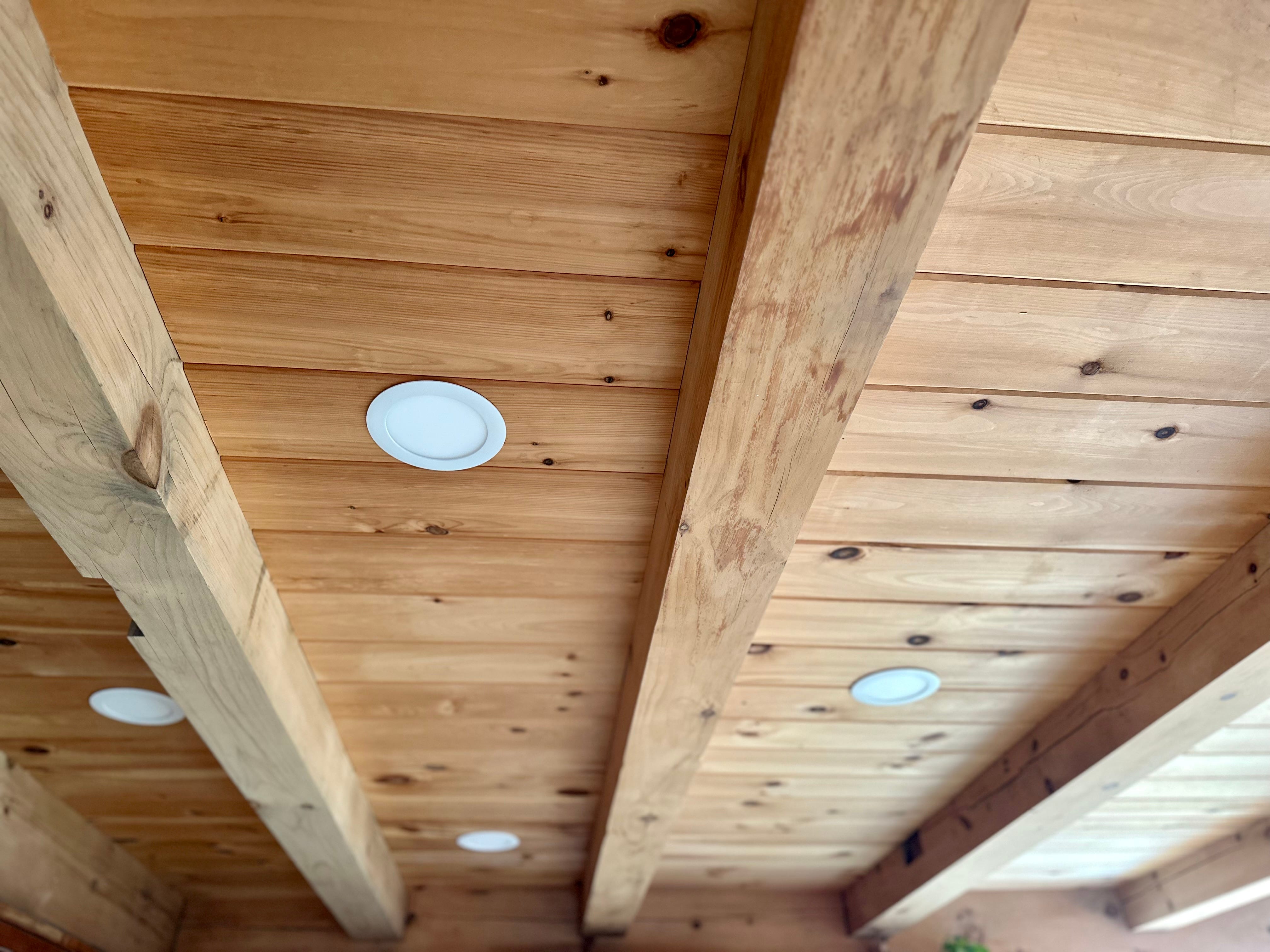 Oak beam ceiling with recessed pot lights