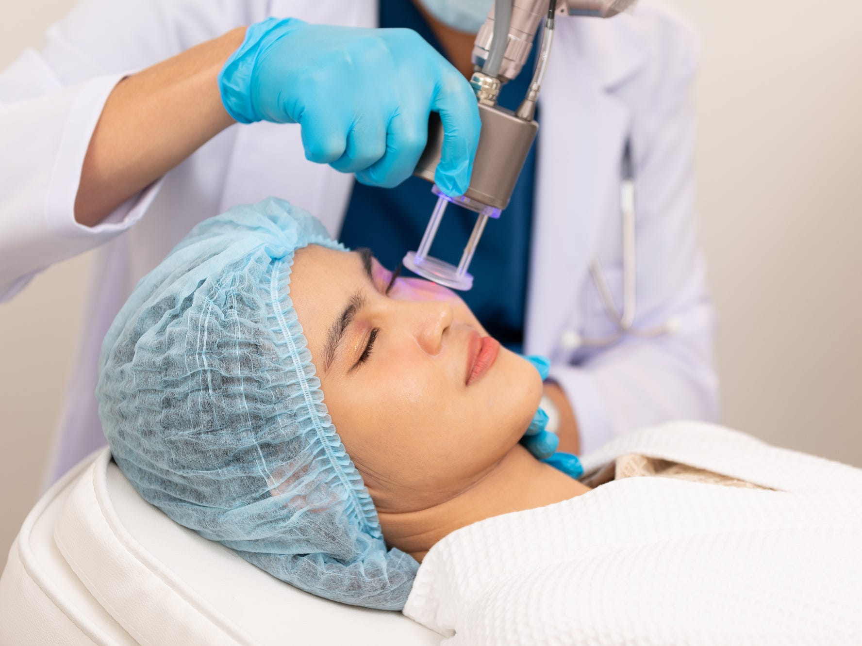 A woman getting a laser resurfacing treatment