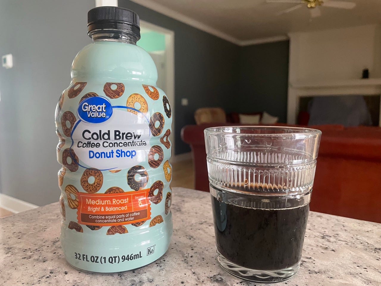 Great Value donut shop cold brew bottle next to glass of cold brew