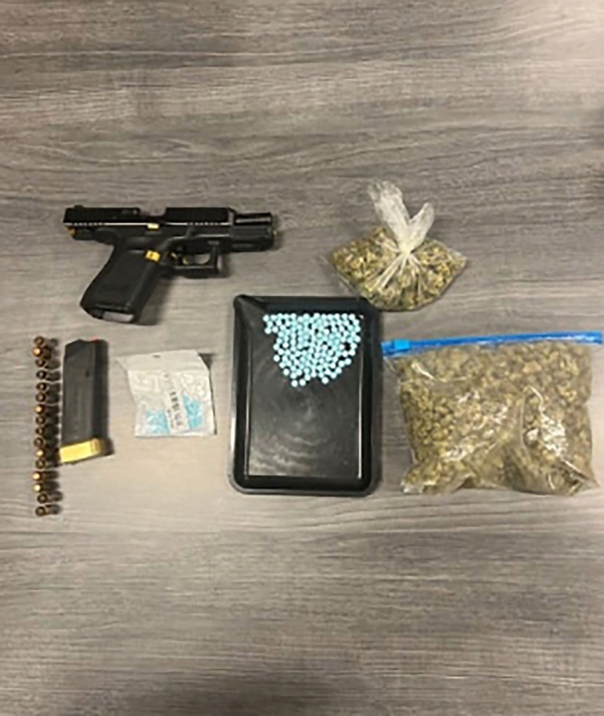 Seized handgun, drugs, and ammunition.